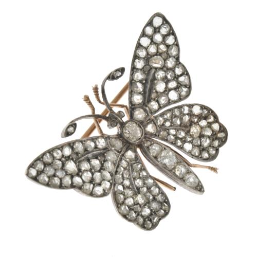 Butterfly-shaped brooch with diamonds.