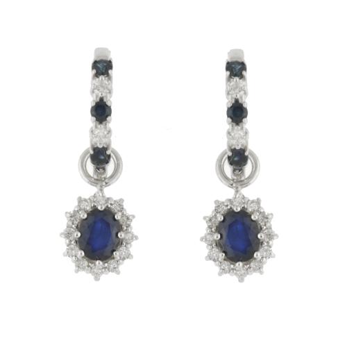 Earrings with sapphires bordered with a diamonds rosette.