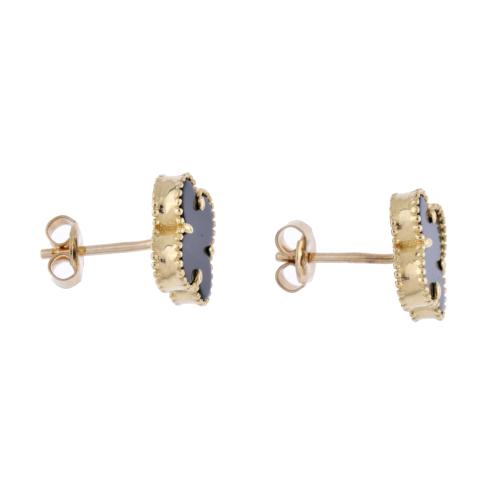 After VAN CLEEF models. "Alhambra" earrings.