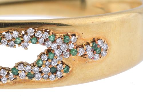 Half-round bracelet with diamonds and emeralds.