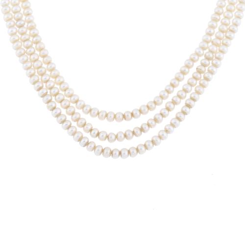 Choker with three strands of cultivated pearls and heart-shaped clasp.