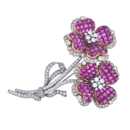 J. ROCA. Floral brooch with diamonds and rubies.