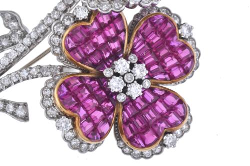 J. ROCA. Floral brooch with diamonds and rubies.