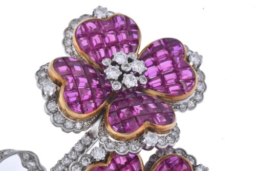 J. ROCA. Floral brooch with diamonds and rubies.