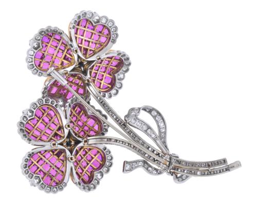 J. ROCA. Floral brooch with diamonds and rubies.