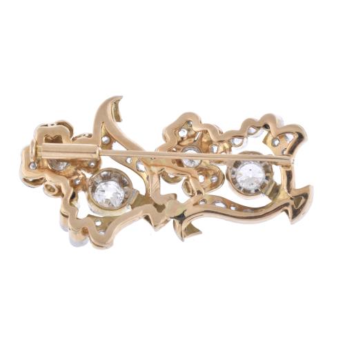 Diamonds floral brooch.