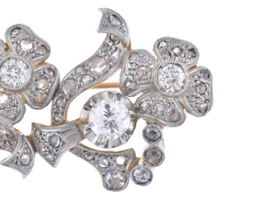 Diamonds floral brooch.