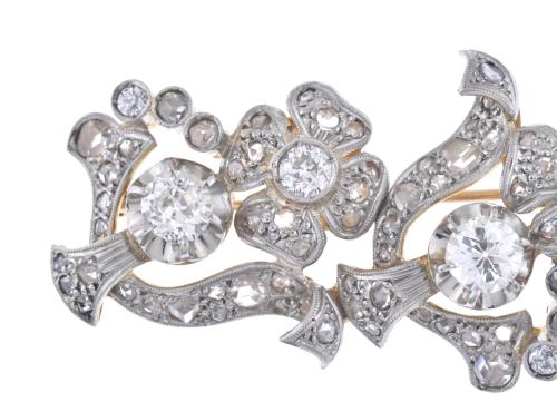 Diamonds floral brooch.