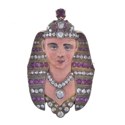 Pharaoh-shaped brooch with diamonds and rubies.