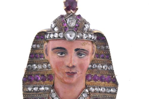 Pharaoh-shaped brooch with diamonds and rubies.