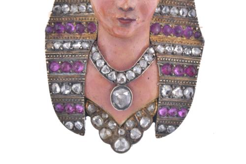 Pharaoh-shaped brooch with diamonds and rubies.