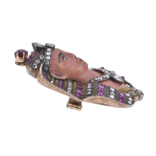 Pharaoh-shaped brooch with diamonds and rubies.