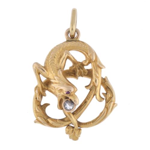 Pendant in the shape of a dragon guarding a diamond.