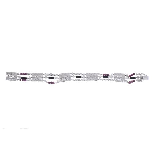 Diamonds, garnets and onyx bracelet.