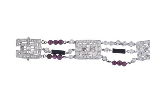 Diamonds, garnets and onyx bracelet.