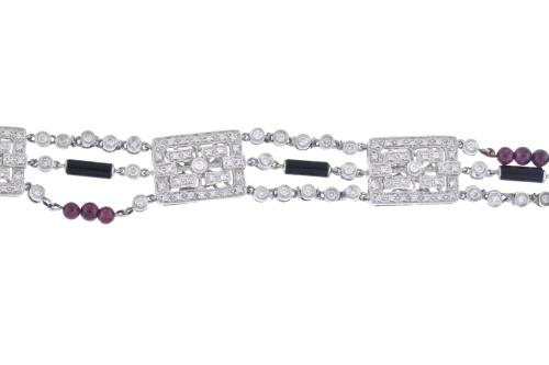 Diamonds, garnets and onyx bracelet.