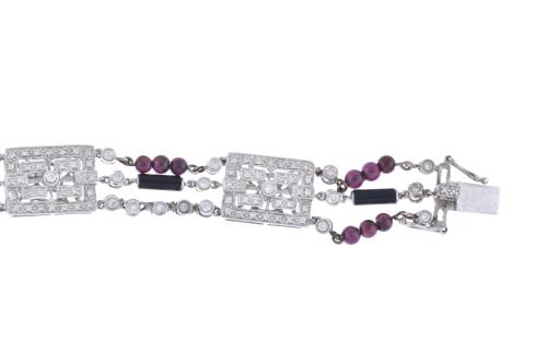 Diamonds, garnets and onyx bracelet.