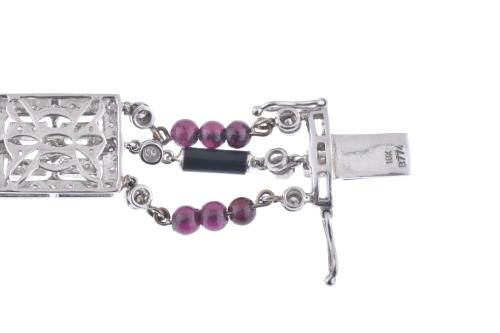 Diamonds, garnets and onyx bracelet.